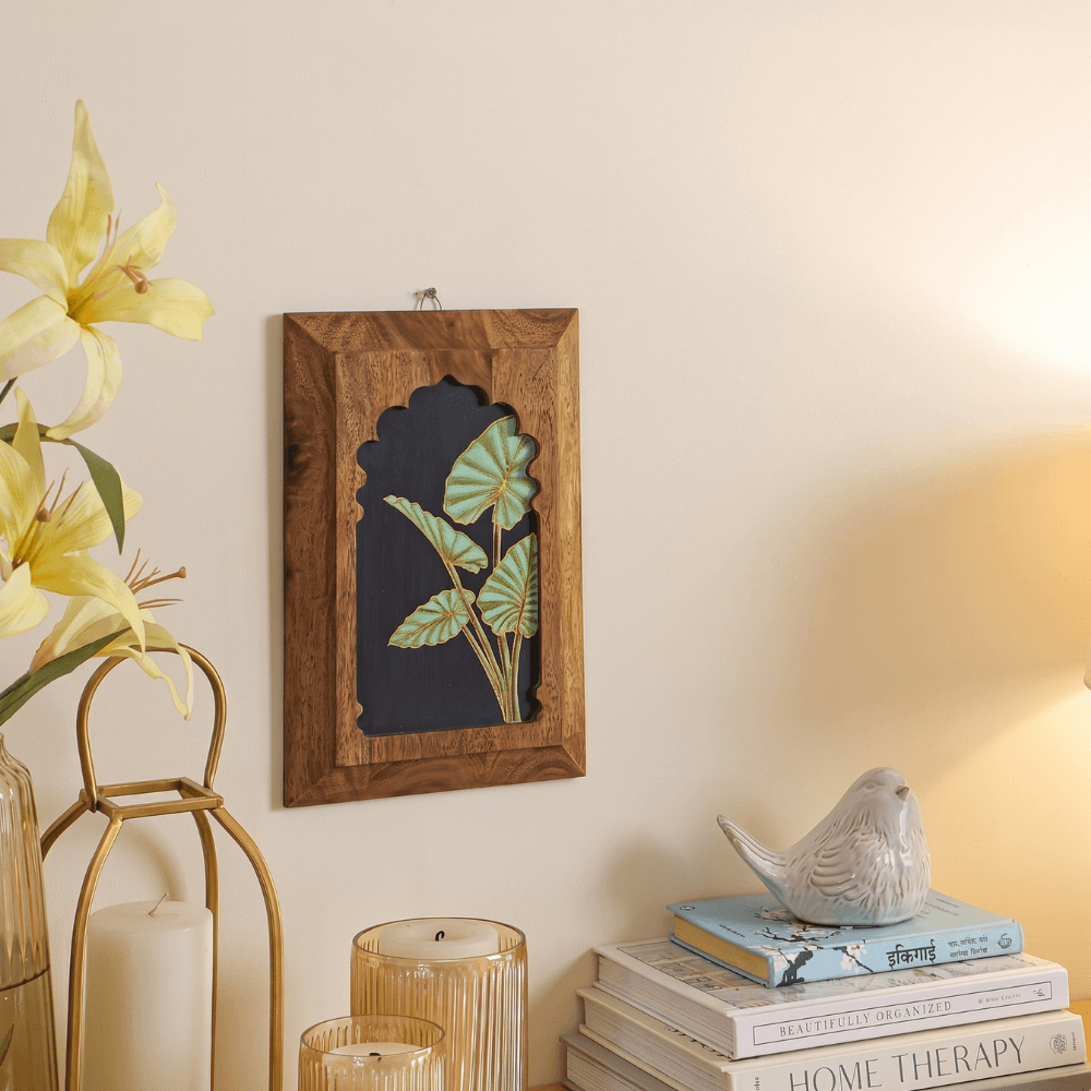Hand-painted Taro Leaf wooden wall art from Mirai Woods Inu Jharokha wall decor, featuring intricate leaf design on natural wood surface.